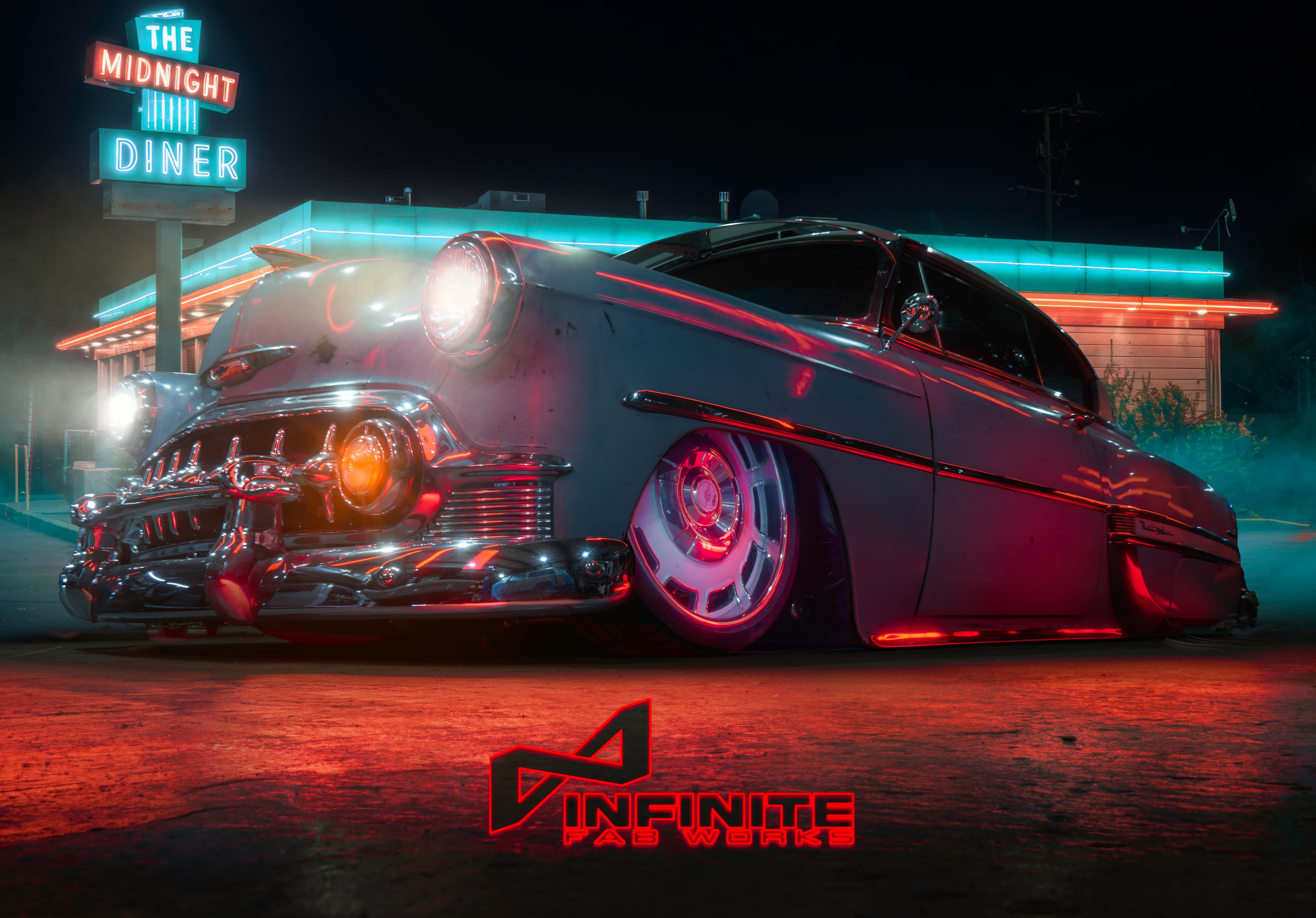 Bel Air sitting on a custom Infinite Fab designed, manufactured and installed suspension that has it sitting flat on the ground.